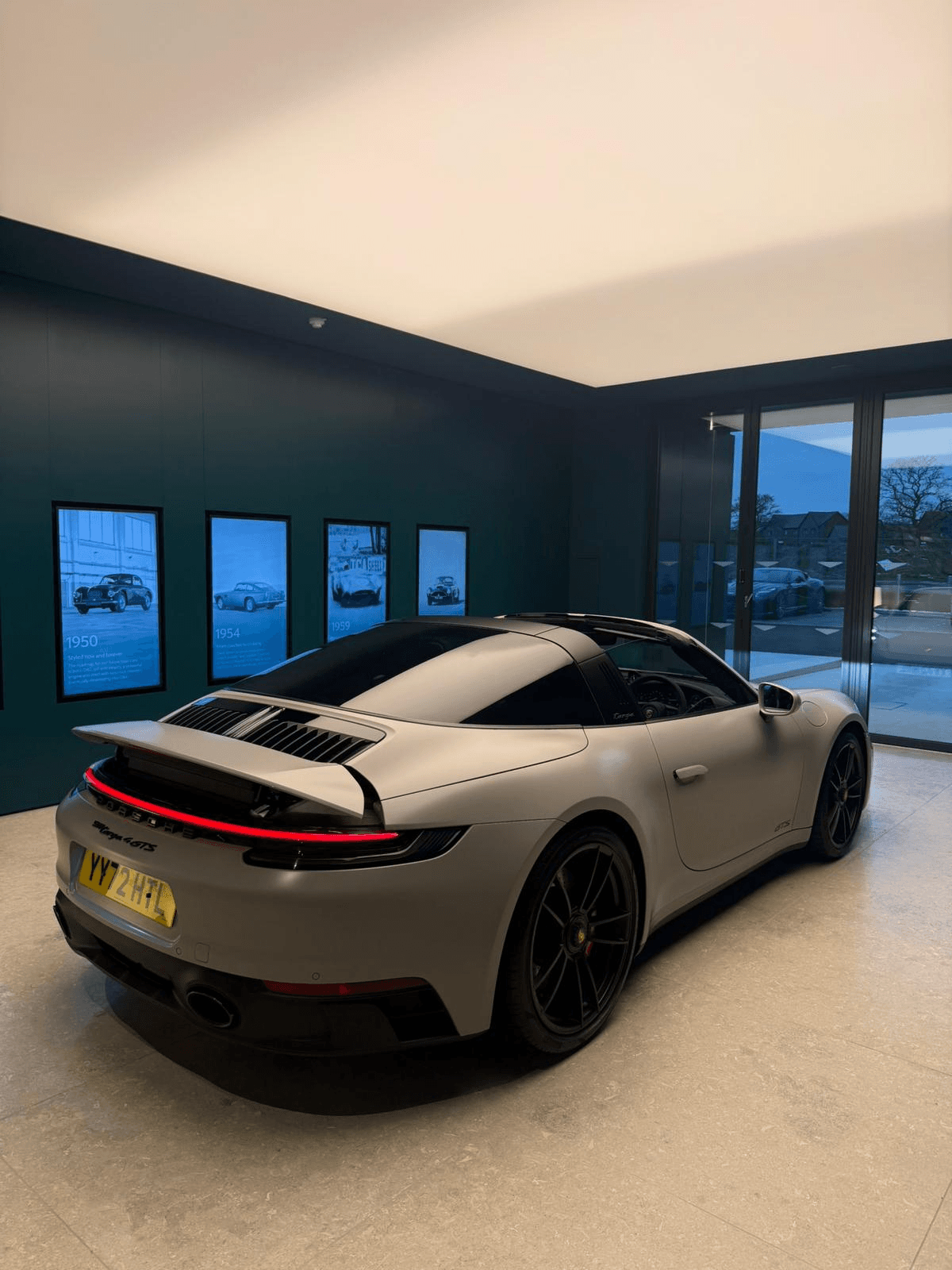 Porsche 911 Targa 4 GTS in a showroom